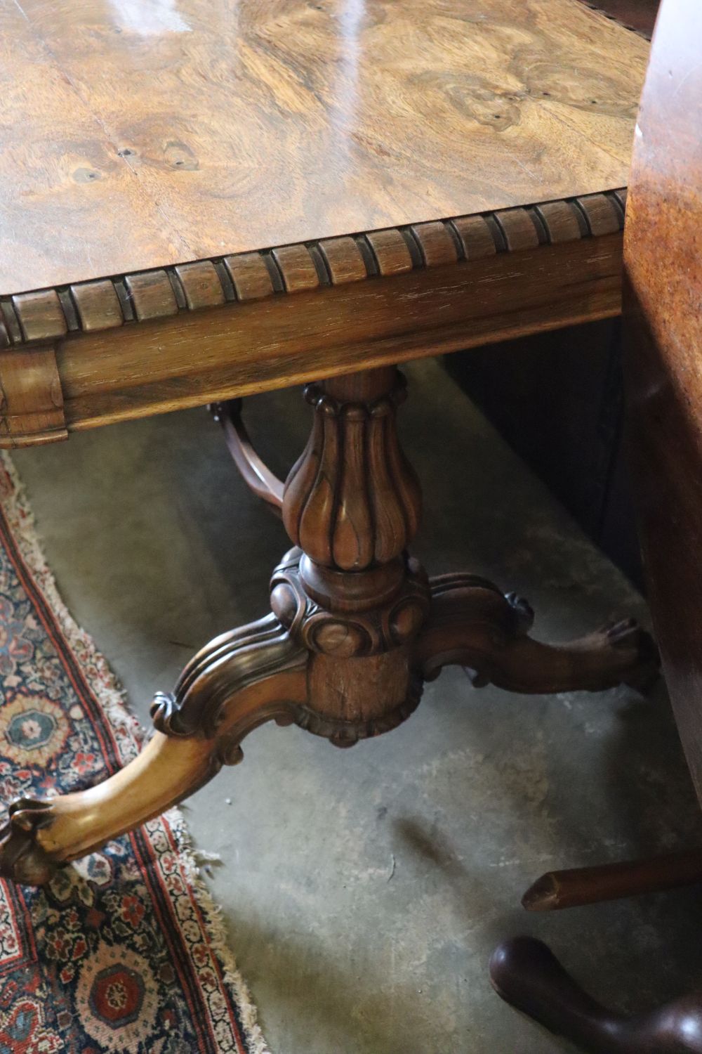 A William IV rosewood centre table, the top with rounded corners and dentil-moulded edge, on lions paw feet, width 136cm depth 70cm